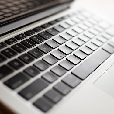 A close up photo of a laptop keyboard.