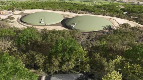 Rendering of two covered water storage tanks situated above a wooded area, with access structures visible on top of each tank.