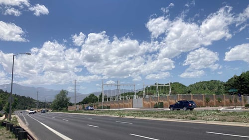 Rendering of substation equipment surrounded by a decorative brick wall. This view looks northwest from Austin Bluffs Parkway.
