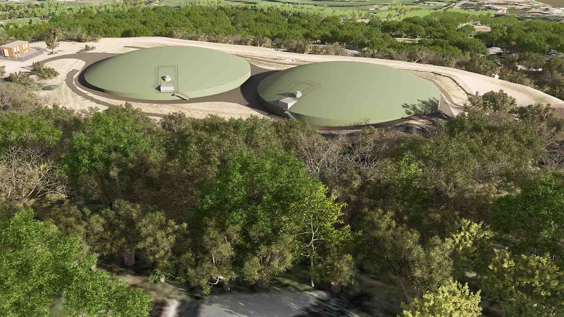 Rendering of two covered water storage tanks situated above a wooded area, with access structures visible on top of each tank.
